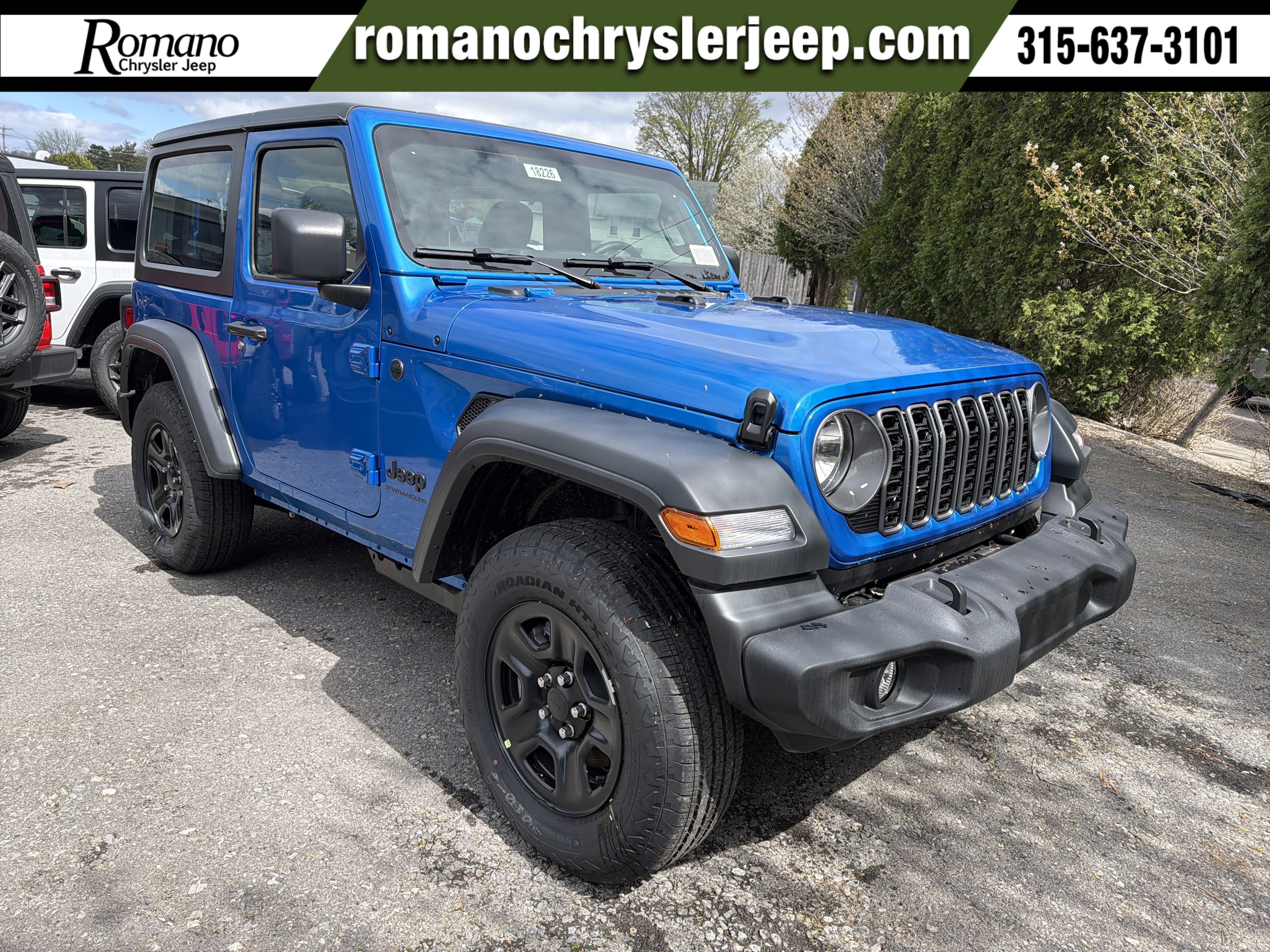 2026 Jeep Wrangler Sport in Hydro Blue Pearlcoat — front three-quarter view