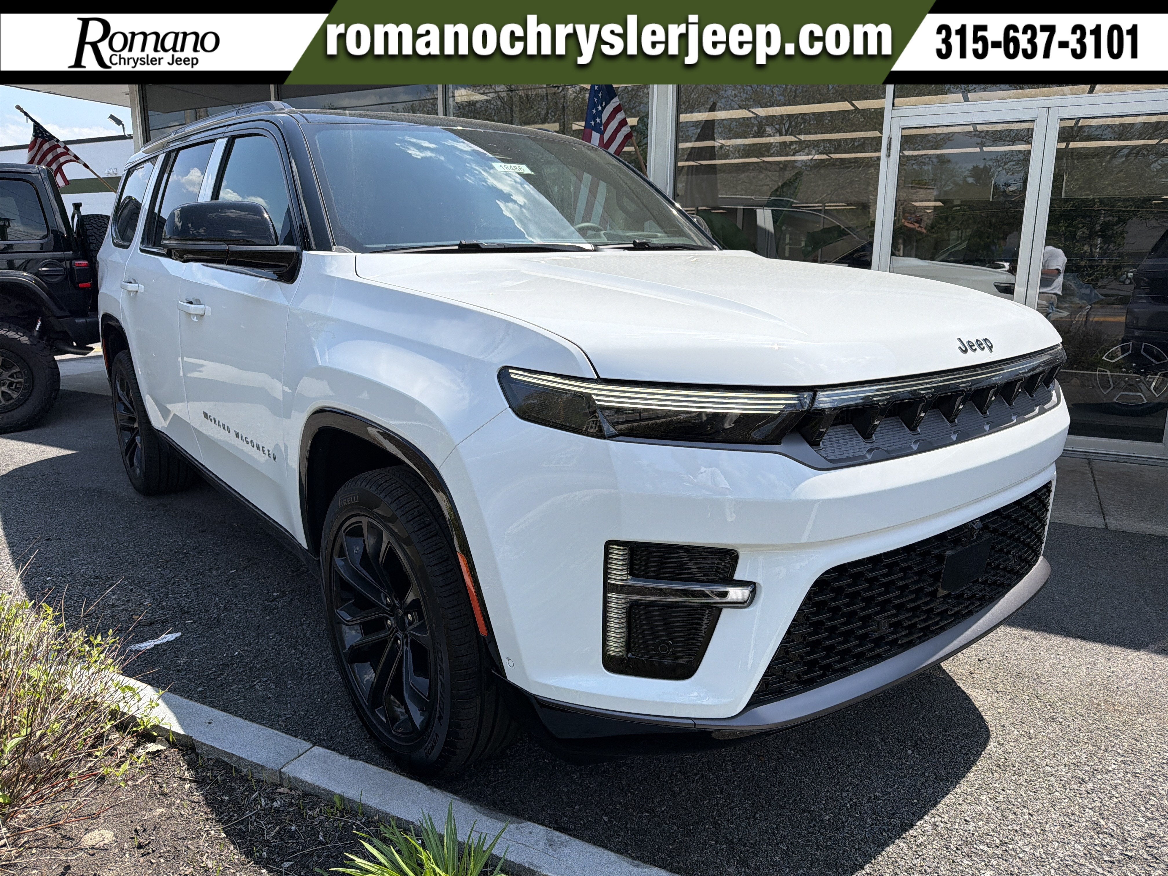 2026 Jeep Grand Wagoneer Summit Obsidian in Bright White Clearcoat — front three-quarter view
