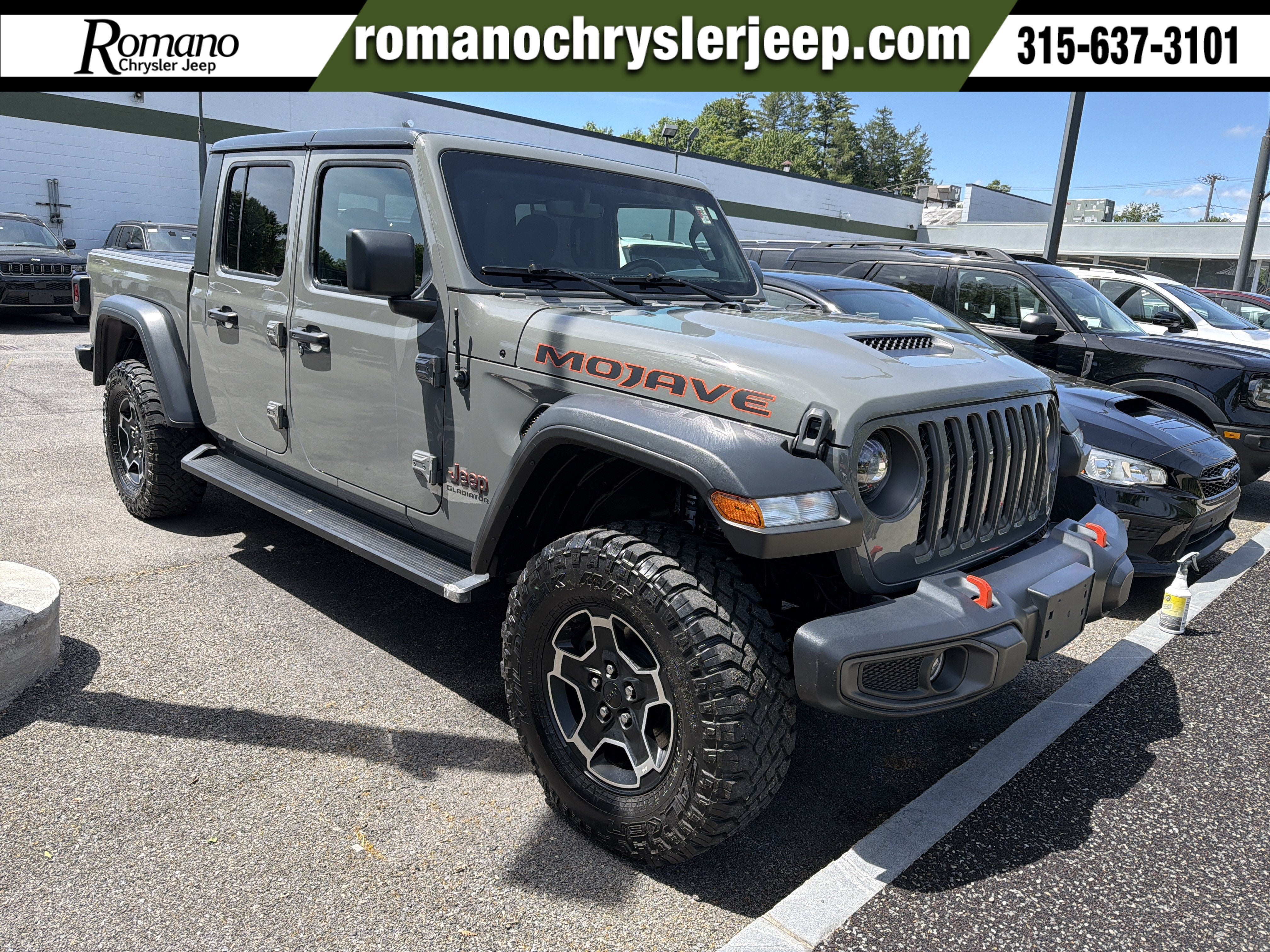 2021 Jeep Gladiator Mojave in Sting-Gray Clearcoat — front three-quarter view