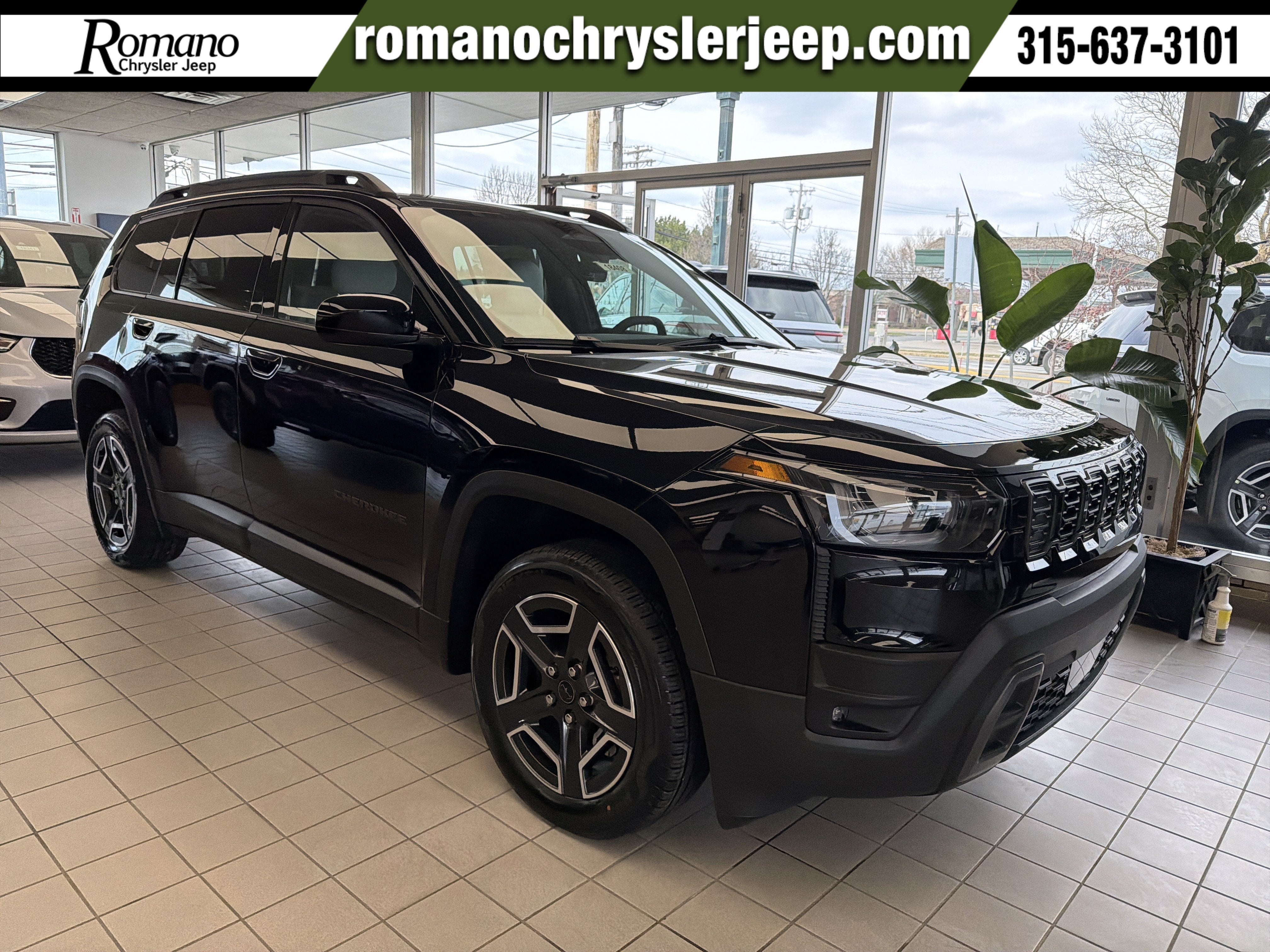 2026 Jeep Cherokee Laredo in Diamond Black Crystal Pearlcoat — front three-quarter view